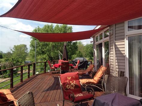 One of the easiest diy patio shade ideas is a fabric canopy. Shade sails from Home Depot. | Backyard ... | Backyard ...