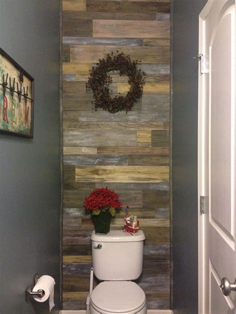 An accent wall can be a great addition to a living room, whether you want to break up a large room or just add an interesting design element. Faux barnwood accent wall in powder room bathroom - Bought ...