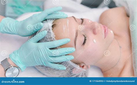 The Female Dermatologist Do Face Massaged To Beautiful Girl Cosmetology Cabinet Or Beauty Clinic