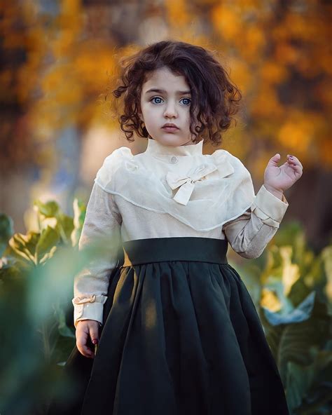Combine pictures from two different people and find what their baby might look like. Image may contain: 1 person, standing | Cute kids photography
