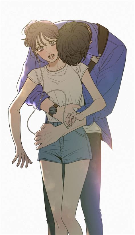 Two People Hugging Each Other With Headphones In Their Ears And One Holding The Other