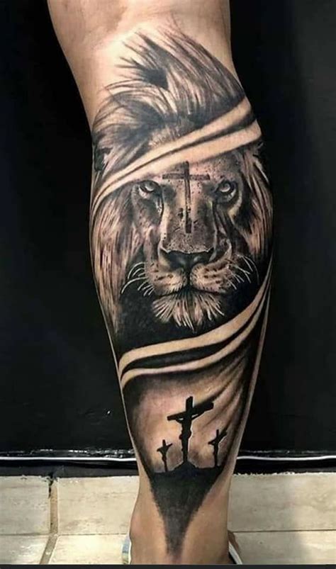 A Mans Leg With A Lion And Cross On It