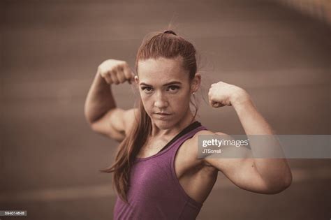 Physically Fit Woman Flexing High Res Stock Photo Getty Images