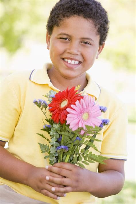 18 Smiling Young Boy Holding Flowers Free Stock Photos Stockfreeimages