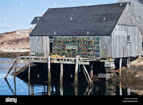 Lobster Traps And Fishing Sheds In The Small Fishing Village And