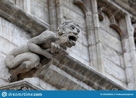 Monstrous Statue With Human Features Called Gargoyle On The Historic