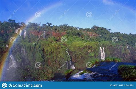 Rainbow Over The Iguacu Water Falls At The Boarder Of Brazil Argentina