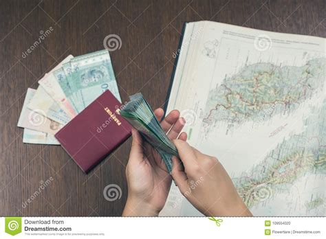 Although previously the malaysian passport photos used to be taken on a blue background, the requirements have now changed. A Bundle Of Malaysian Money In Female Hands On The Map Of ...