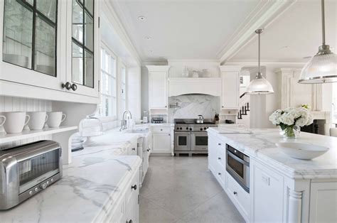 The Kitchen Is Filled With Statuary Marble