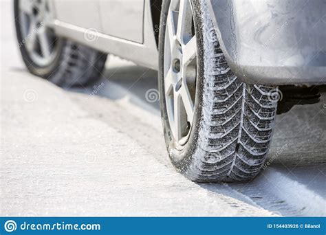 Close Up Of Car Wheels Rubber Tire In Deep Snow Transportation And