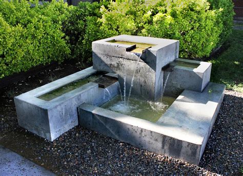 Relax to the soothing sounds of water. DIY Concrete Water Feature | Backyard Design Ideas
