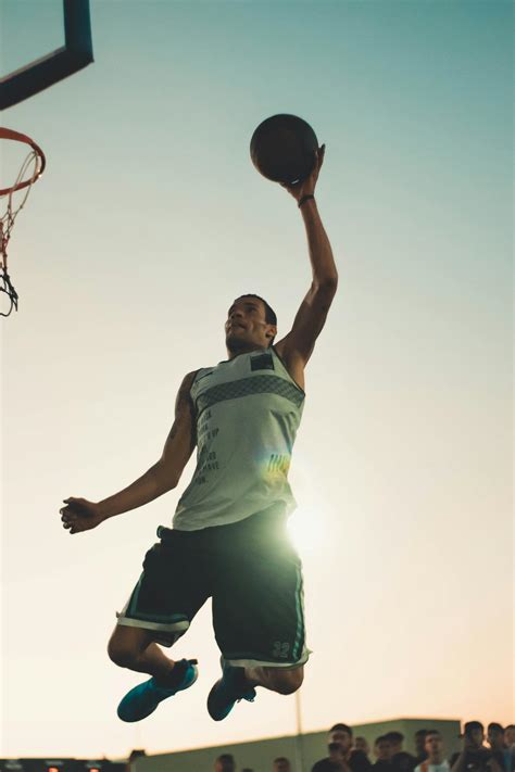 Photo Of Man Doing A Dunk · Free Stock Photo