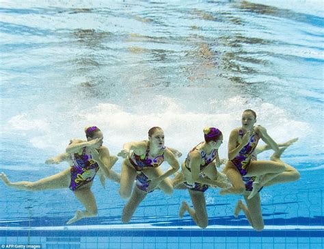 Underwater Photographs Show Synchronised Swimmers Competing At European