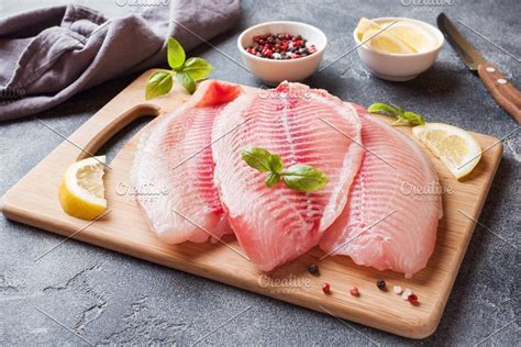 Raw Fish Fillet Of Tilapia Containing Tilapia Fillet And Red