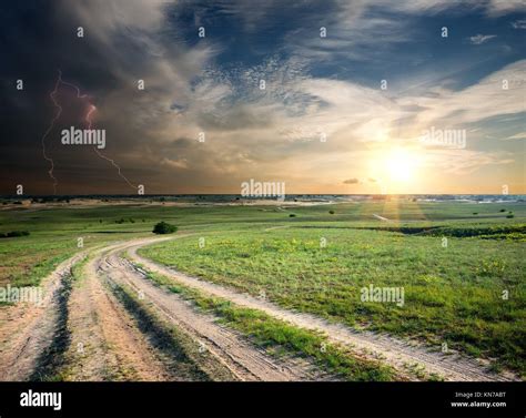 Storm Over The Country Road In Field Stock Photo Alamy