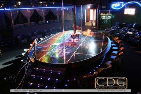 Custom elliptical stripclub stage design with holographic dance floor by holowalls 카지노