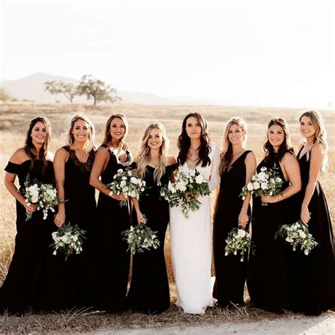How Gorgeous Is This Look Bridesmaids In Black The Bride In All White