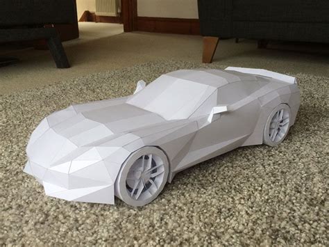A Paper Model Of A Sports Car On The Floor
