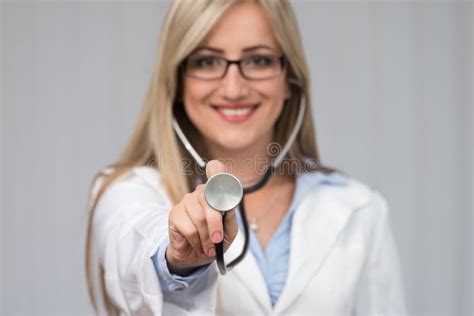 A Female Doctor With A Stethoscope Listening Stock Photo Image Of