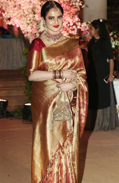 Rekha Glows In Red And Gold At Wedding John And Wifey Priya Look Picture Perfect At Force 2