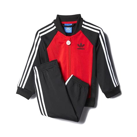 Check out our adidas tracksuit selection for the very best in unique or custom, handmade pieces from our men's clothing shops. Adidas Kids I P SS Tracksuit, Black Red | Highlights