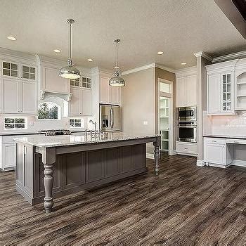 The grey cabinets certainly look at home here thanks to the similarly colored backsplash tiles and kitchen wall. Freestanding Grey Kitchen Island Design Ideas