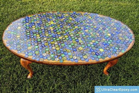 Hudson 60 round clear epoxy resin coffee table with brass finish hairpin legs. Bottlecap Coffee Table Sealed with Clear Resin ...