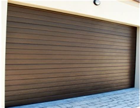 The door runs along a side wall of your garage leaving the ceiling area free for use as storage space and a false wall can be built. Aluzinc Garage Doors | Sa Garage Doors