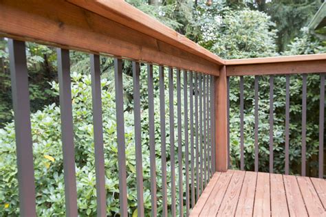 Some metal deck railings have metal balusters and wood top railings. Installing Deck Railing | Aluminum Balusters For Deck ...