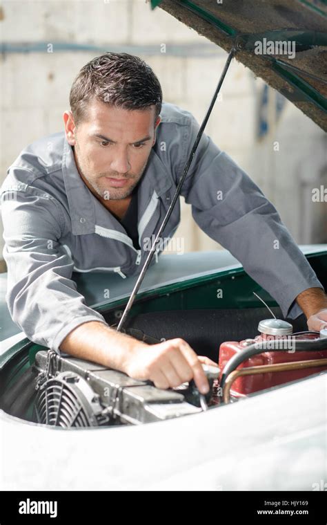 Man Trying To Fix His Car Stock Photo Alamy