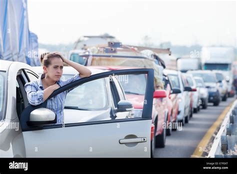Frustrated Young Hispanic Woman Stuck In A Traffic Jam Stock Photo