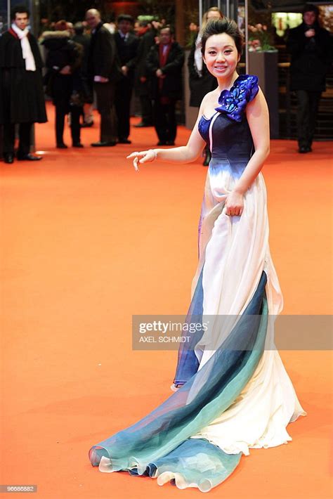 chinese actress yan ni poses for photographers as she arrives on the news photo getty images