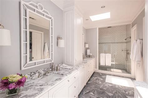 Bathroom vanity cabinet high reflective white white countertop subway tile accent feature wall kylie m interiors edesign online paint color consultant. White and Grey Marble Bathroom Countertops - Transitional ...