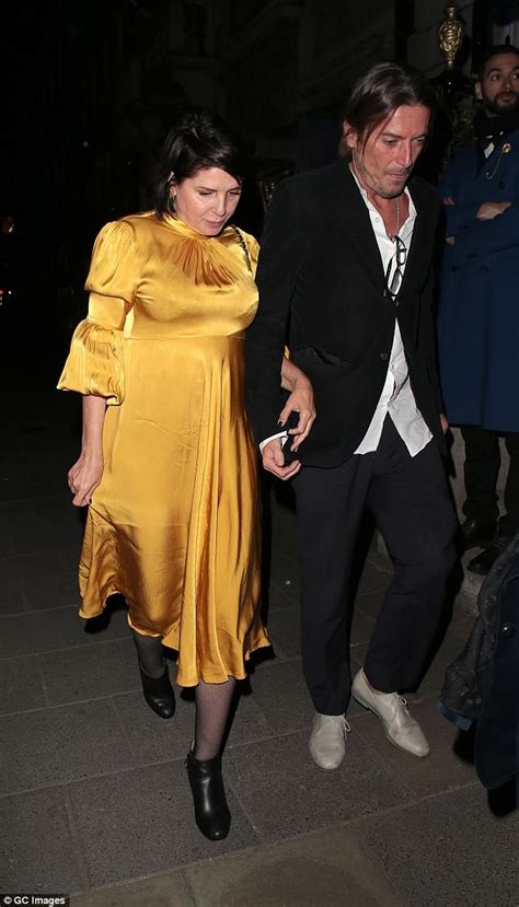 Sadie Frost Stuns In Yellow Silk Dress With Partner Darren Strowger
