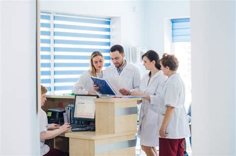 Doctor And Receptionist At Reception In A Hospital Stock Image Image
