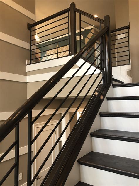This indoor railing idea was inspired by a ship's rails. MODERN HORIZONTAL IRON RAILING | New homes, Interior railings, House