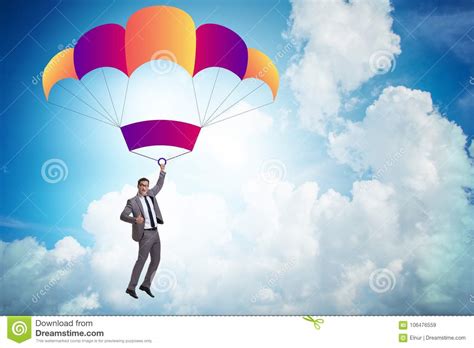 The Young Businessman Falling On Parachute In Business Concept Stock