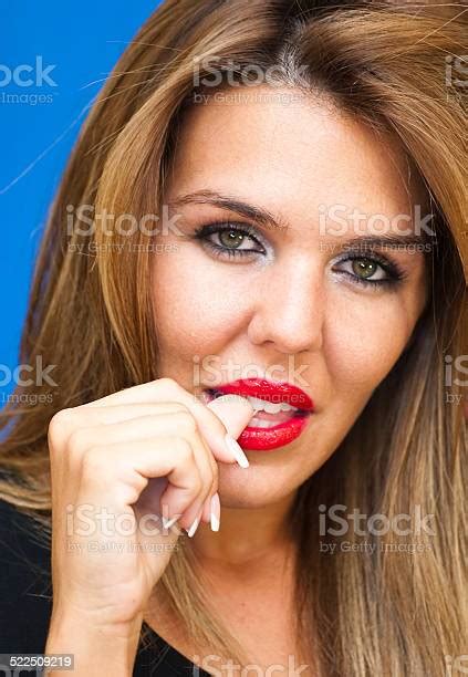 Beautiful Woman Biting A Finger Stock Photo Download Image Now