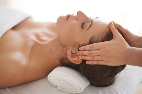 Pure Relaxation Close Up Shot Of A Young Woman Receiving A Head Massage At A Spa Stock Image