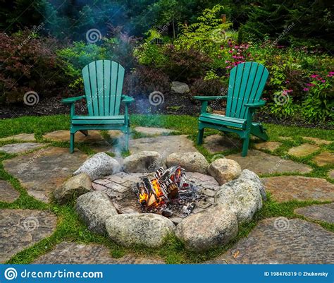 Adirondack Chairs Around Fire Pit Stock Image Image Of Cottage