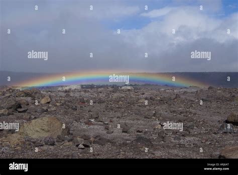 Rainbow Over The Volcano Crater Stock Photo Alamy