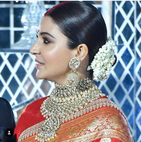 Play around with the pin ups. Makeup, jewellery & hair of Anushka Sharma for her wedding ...