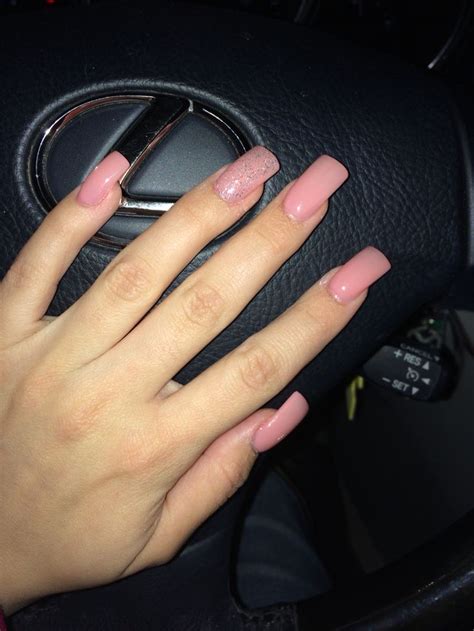 Long pink acrylic nails with accent glitter | Pink acrylic ... Pinks are considered to add some glam.