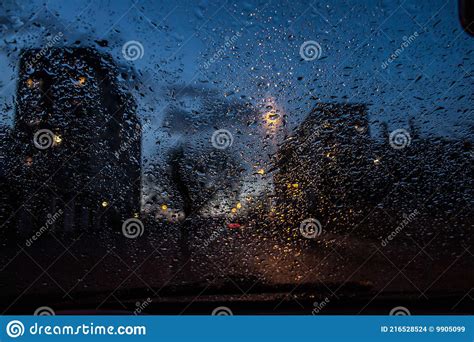 View From The Car Window Through The Rain In The Evening Background