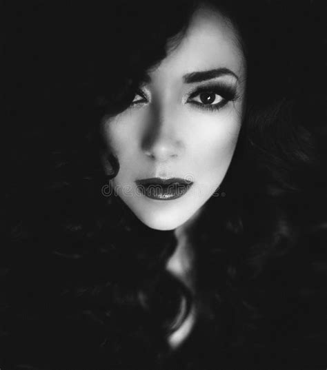 Black And White Portrait Of A Beautiful Woman With Dark Hair Stock