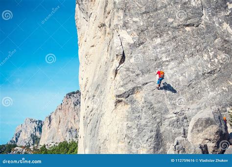 The Climber Is Hanging On A Rope Stock Photo Image Of Balance