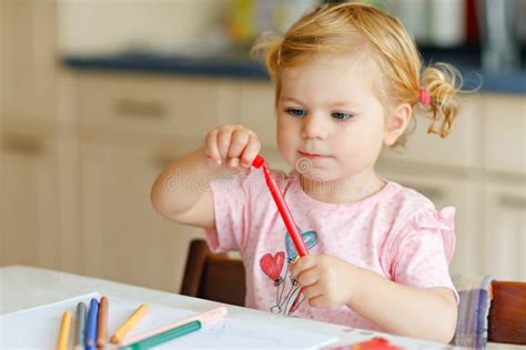 Cute Adorable Baby Girl Learning Painting With Pencils Little Toddler