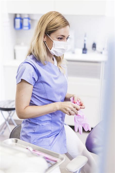 Download Female Dentist Wearing Gloves In Clinic For Free In 2021