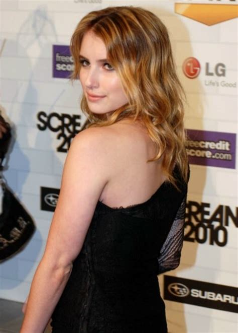 Emma Roberts Wearing Her Long Hair With Curls That Are Resting Upon Her