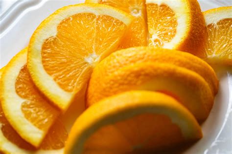 Close Up Of Fresh Orange Slices In Plate Stockfreedom Premium Stock